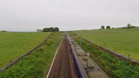 A Scotrail express passenger train on the Glasgow to Edinburgh line. Stock Footage 309958465