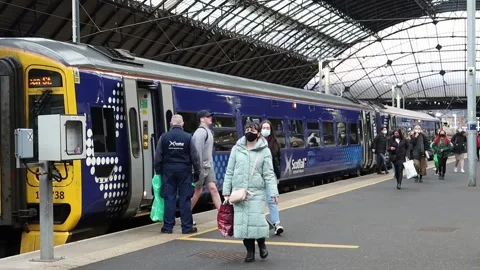 Scotrail passengers and train at Glasgow Queen Street station Stock Footage 170232443