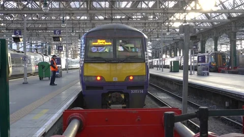 Scotrail train leaving a platform at Glasgow Central railway Station, Scotland, Stock Footage 228891138
