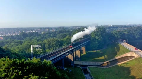 Scots guardsman 41165 passing through carr mill dam, St Helens Stock Footage 160472805
