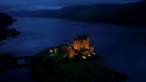 A Scottish castle is lit up at night Stock Footage 306619859