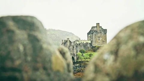 Scottish castle surrounded by mountains Stock Footage 94656021