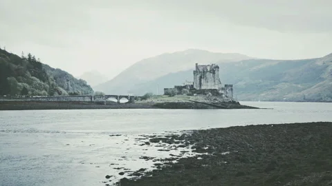Scottish castle surrounded by mountains Stock Footage 94656050