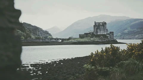 Scottish castle surrounded by mountains Stock Footage 94656215