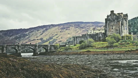 Scottish castle surrounded by mountains Stock Footage 94656243