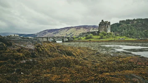 Scottish castle surrounded by mountains Stock Footage 94656449