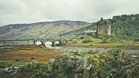 Scottish castle surrounded by mountains Stock Footage 94658804