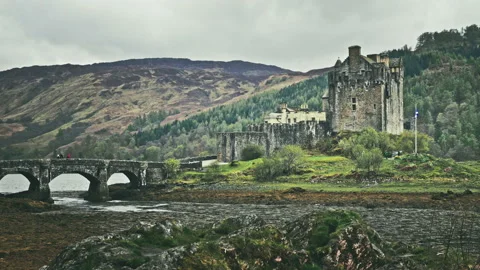 Scottish castle surrounded by mountains Stock Footage 94658921