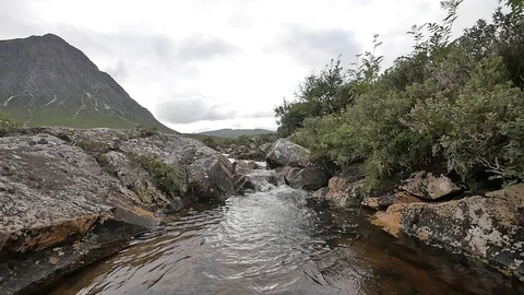 Scottish Countryside with a Brook and A Sharp Hill in the Background 스톡 동영상 97361859