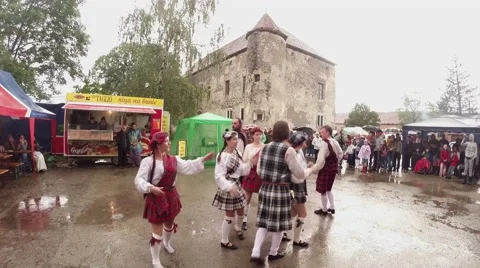 Scottish dancing on the pavement near the old castle and the audience Stock Footage 46685205