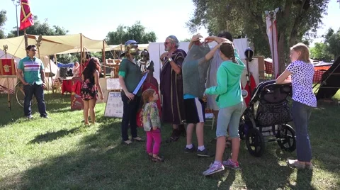 Scottish, display with boy trying on chainmail Stock Footage 49567934