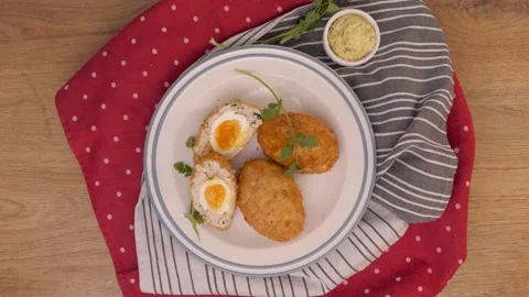 Scottish egg on a plate, spinning, serving  Video stock 163835344