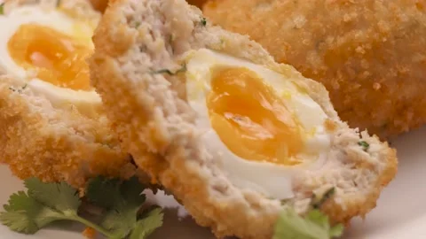 Scottish egg on a plate, spinning, serving  Video stock 163835360