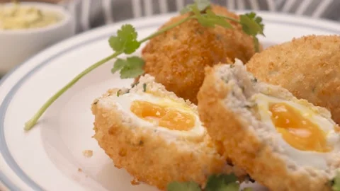 Scottish egg on a plate, spinning, serving  Video stock 163891727