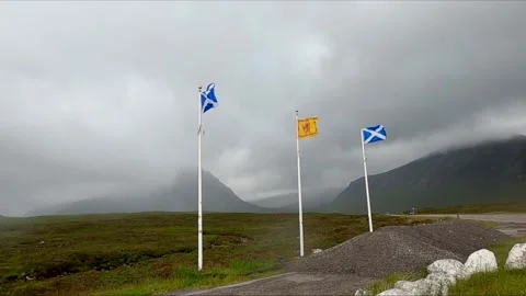 Scottish flags blowing in the wind Glencoe Scotland UK Stock Footage 135745562