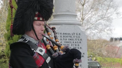 Scottish Highland piper medium shot front backpipes Stock Footage 58548633