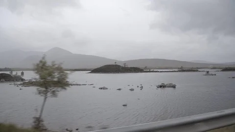 Scottish highlands lake slow mo cloudy moving Stock Footage 69753803