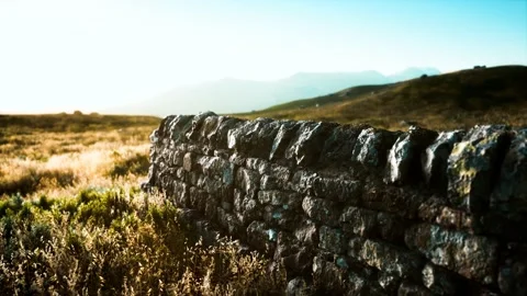 Scottish land border stone wall at sunset Stock Footage 150469237