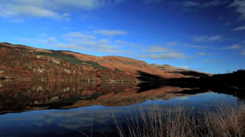 Scottish loch and cloud reflection timelapse Stock Footage 981010