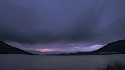Scottish loch dramatic evening timelapse, colour change at sunset orange to blue Stock-Footage 313637953