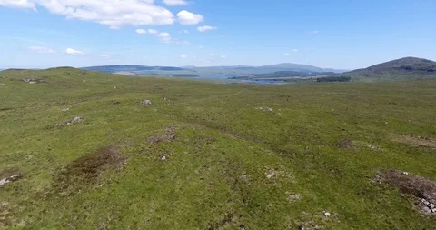 Scottish Low Hilly Landscape Drone Shot with Blue Skies 스톡 동영상 97378616