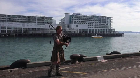 Scottish man play bagpipe Stock Footage 64011108