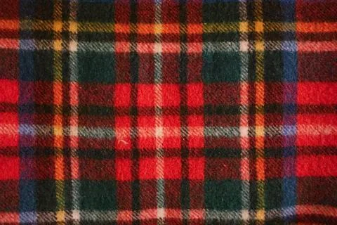 Scottish plaid textile fabric creating colorful tartan pattern with red, gr.. Stock Photos