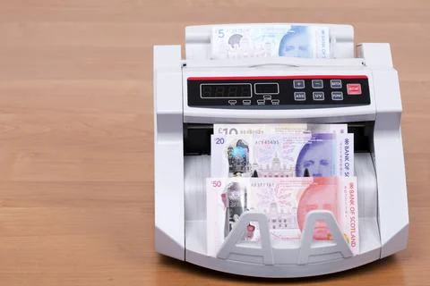 Scottish Pounds in a counting machine Stock Photos
