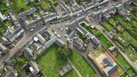 Scottish Round Tower Drone Clip with Churchyard, Abernethy 11th Century 4K Stock Footage 145923748