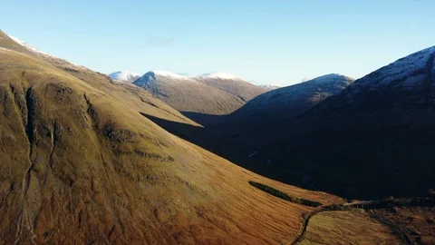 Scottish valley and bridge in the Highlands of Scotland aerial. Stock Footage