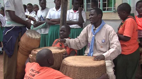 Scout drumming and childs singing Stock Footage 36440026