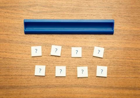 Scrabble tiles with questionmark Stock Photos