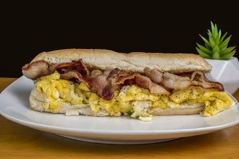 Scramble egg  amnd maple bacon in a sub roll Stock-Fotos
