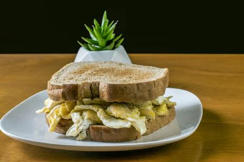 Scramble egg on toasted wheat bread with coffee Stock Photos