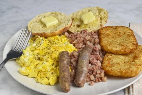 Scramble eggs with corn beef hash and  hash browns Stock Photos