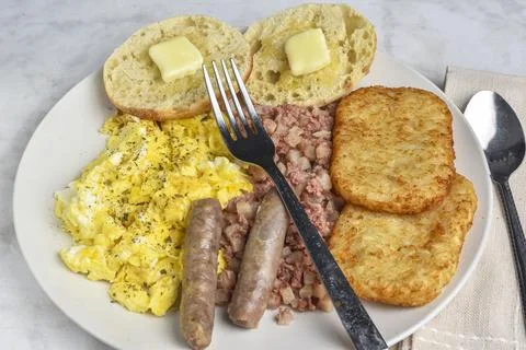 Scramble eggs with corn beef hash and  hash browns Stock Photos
