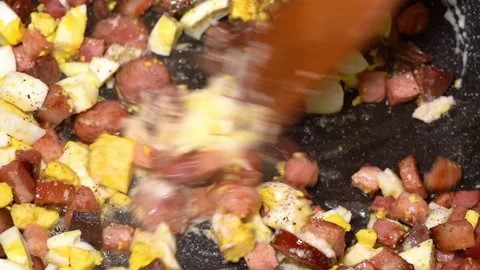 Scrambled egg cooking process with meat in a frying pan Stock Footage 250614561