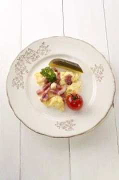 Scrambled egg with grilled bacon Stock Photos