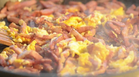 Scrambled eggs and fried sliced bacon Stock Footage 34281086