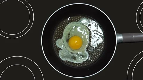 Scrambled eggs are fried in a hot pan. Stock Footage 138099306