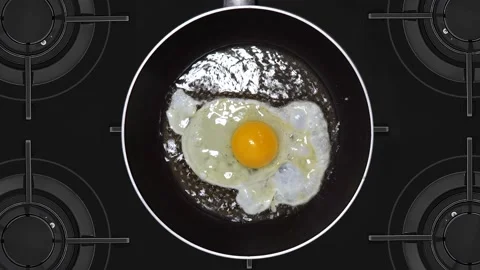Scrambled eggs are fried in a hot pan. Stock Footage 142750305