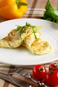 Scrambled eggs with arugula Stock Photos