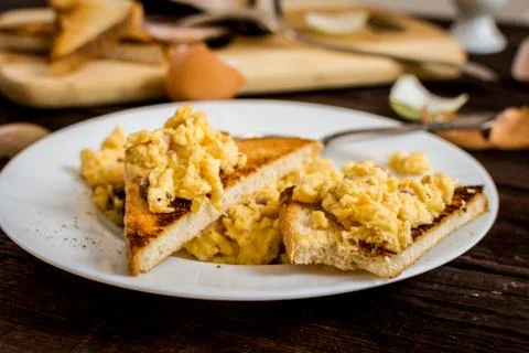 Scrambled eggs with bacon Stock Photos