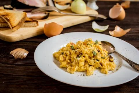 Scrambled eggs with bacon Stock Photos