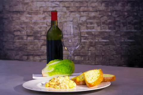 Scrambled eggs with bread and fresh lettuce Stock Photos