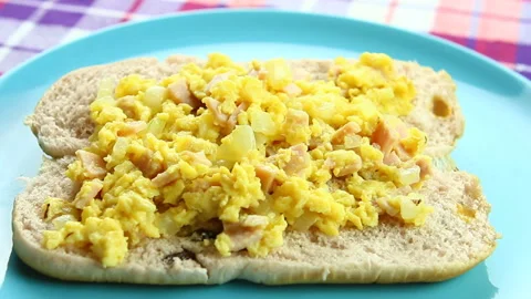Scrambled eggs on bread ,  close up in studio Chiangmai Thailand. Stock Footage 166391368