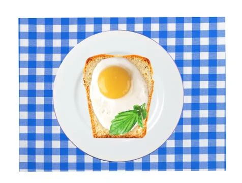 Scrambled eggs with bread on plate, on color napkin Stock Photos