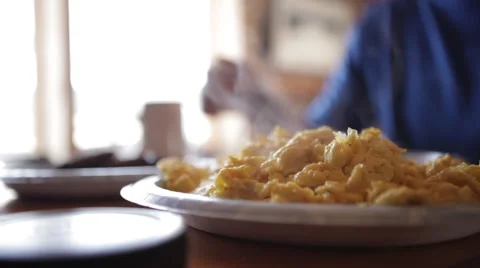 Scrambled eggs for breakfast in cabin Stock Footage 62442308