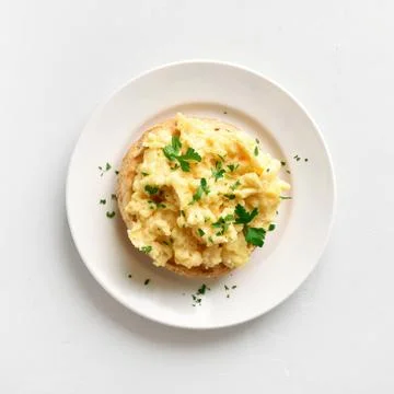 Scrambled eggs on bun Stock Photos