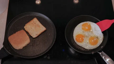 Scrambled eggs cooking. three Scrambled eggs on hot frying pan. 4k video. slo Stock Footage 219454641